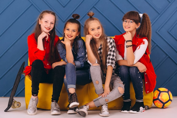 Kids smiling in sports uniforms